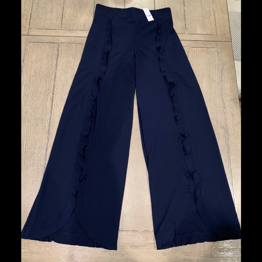 New with tags. Navy blue ruffled palazzo pants.